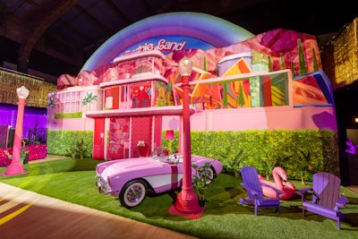 The AKJOHNSTON team also backdropped the space with a 36-foot-tall inflatable that created a collage of iconic locations from Barbie Land and surrounded the room with sets inspired by the movie.
