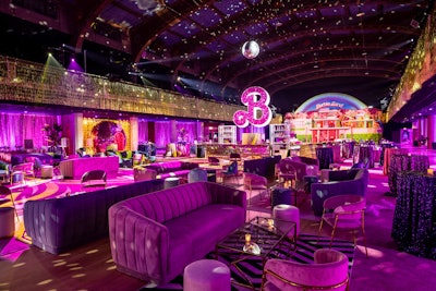The central bar featured an 11-foot-tall signature 'B' in all of its 'pink-glittered glory,' and it rotated slowly under a 5-foot disco ball.
