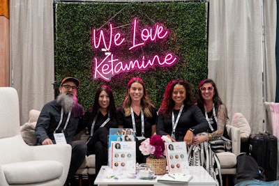 Colorado-based Ballen Medical & Wellness, which centers on holistic treatments to promote well-being and performance, attracted guests with its “We Love Ketamine” neon signage set on a greenery wall. The South Denver clinic combines talk therapy with ketamine treatment.