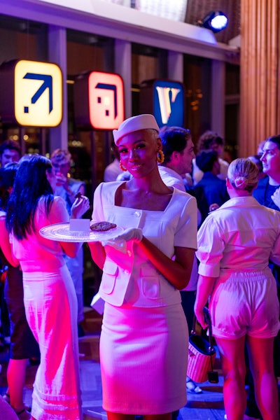 The evening was capped off with late-night comfort food, including warm cookies served by staff who were styled by fashion mainstay Posh McKoy in retro-meets-modern flight attendant regalia.