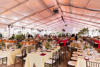 Inspired by the zoo’s giraffe inhabitants, the ball’s theme was “Reaching New Heights.” Inside the dinner tent, decor from Vince Hart Designs was meant to evoke a sunset in the Serengeti, where giraffes roam freely.