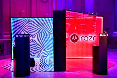 Motorola also leaned into Y2K nostalgia last month during a launch event for the Motorola Razr+. Produced by Mirrored Media, the event was designed as a mind-bending playground with two stages, an LED backdrop, and a performance partnership with Cirque du Soleil. Photo moments highlighted the four colors in which the flip phone is available, including a pink color for the first time since the early 2000s. The rosy shade, called Viva Magenta, is also the 2023 Pantone Color of the Year.