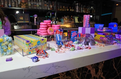 Lana Nicole Events created Bliss-branded candy and treats for the party, which sat alongside nostalgic candy brands from the era.