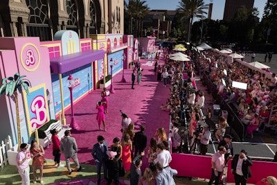 The event was designed by 15|40 Productions, and Warner Brothers' goal was to 'create 'Barbie Land' by bringing the worlds and environments you see in the film into a format that would work and fit on an arrivals carpet,' said Gillian Deeds, senior producer at 15|40. The guest flow and experience were extremely important to the success of the event, Deeds said. 'Warner Bros. wanted to ensure that the 400 fans fit in view areas on the carpet and were provided some of the best viewpoints to see the action as it unfolded once the night started,' she explained. 'Additionally, we spent time with the scenic team and our partners and collaborators at Warner Bros. to ensure that the pinks were correct, and if they needed to be custom, we made them custom.'