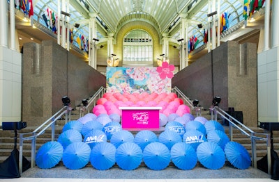 In 2018, the National Cherry Blossom Festival's annual Pink Tie Party fundraiser took place at the Ronald Reagan Building and International Trade Center in Washington, D.C. Design Foundry designed the event, which included cascading rows of umbrellas that created a pink-to-blue ombré effect that complemented a painting of cherry blossoms. See more: Pretty In Pink: 16 Spring-Friendly Ideas From National Cherry Blossom Festival Events