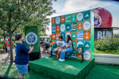 The space also offered a throwback, wheat-pasted photo op with custom-made seating, along with turf from the pitch, authentic park picnic tables, and fresh fruit in baskets with Adidas x NYCFC stickers.