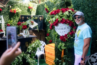 Guests posed with branded props including an oversize, leafy bottle of gin. Elsewhere in the garden, there was a branded swing and wrought-iron cafe tables.