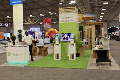 A booth design that stopped us in our tracks: Fielddrive's sustainability-themed booth. Attendees could interact with the event tech company's printable badges made with biodegradable paper and seating made out of cardboard.