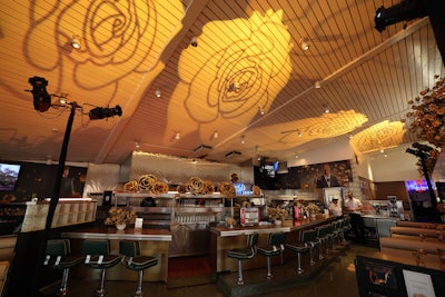 Golden roses were also projected on the ceiling of the old-school eatery.