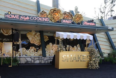 Mel's Drive-In—which hosted a campaign kickoff event Sept. 21, as well as public-facing promotions from Sept. 22-24—immediately drew attention with oversize golden roses on the roof and as window decals. Fans could stop by all weekend for a complimentary 'golden milkshake,' which was adorned with the phrase 'shaking things up.'