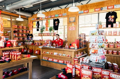The pop-up shop—which took over The Station, a renovated 1949 service station that can be rented for private events—was a throwback to nostalgic roadside gift shops. The aisles were lined with mementos and hard-to-find Cheez-It flavors available for purchase. Visitors could also shop exclusive merch and collectibles, or send postcards, to commemorate their visit to the cheesy attraction.