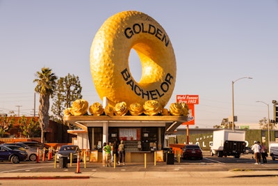 For a limited time, Randy's Donuts in Inglewood, Calif., is offering a limited-edition golden doughnut, a 'Golden Hour' special from 5-7 p.m. daily, and a 10% discount the day of the premiere. ABC worked with Experiential Supply Co. to transform the historic eatery's iconic doughnut.