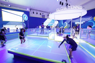 Once inside the Fan Experience, tennis enthusiasts could try their hand at glow tennis, which an Amex spokesperson told BizBash was a fan favorite. Elsewhere on site, guests could beat New York’s record heat by getting a cryotherapy treatment courtesy of Kollectiv, or recharge with a massage using Therabody equipment. To tap into a more artistic side, guests were also invited to help color in an interactive mural or claim digital collectibles like non-fungible tokens, both designed by Argentine artist Vero Escalante.
