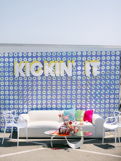 Glow Events also activated the venue's outdoor space with eye-catching photo ops and plush lounge seating. Modest Peach created this eight-foot-tall CD wall adorned with 600 handplaced CDs.