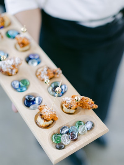 Foxtail Catering pulled out all the stops for a nostalgia-filled menu. Out: tray-passed service. In: mancala board service.