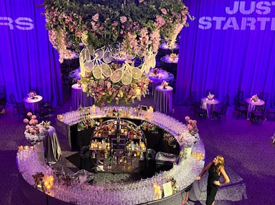 The star of the show (besides King, of course): a 15-by-15-foot chandelier made of tennis racquets and lush florals suspended above a bar that was nothing short of breathtaking.