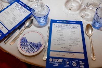 The table settings at the Alain Ducasse & Friends: Celebrating the 15th Anniversary of Benoit New York dinner featured a classic red, white, and blue theme.