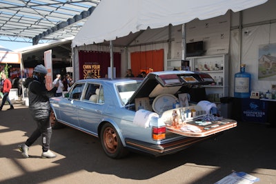 Drumshanbo Gunpowder Irish Gin set up a bar in the trunk of a vintage car.