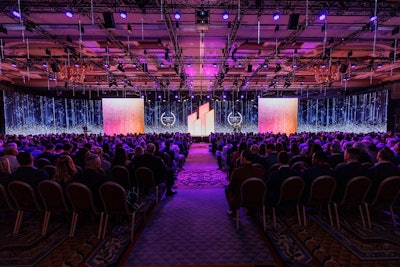 The 1,200-attendee meeting's panoramic main stage was created with 980 LED panels spanning five screens, complemented by 225 tailor-made kinetic LED lights that shifted and synchronized with the content. 'By incorporating the overhead kinetic LED lights, we extended the stage above the audience and enhanced the sensory experience of the content by bringing it closer—as close as four feet above attendees' heads,' said Wilson Dow Group's Gino Pennacchio.