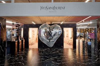 In the center of the club floor stood a larger-than-life disco ball heart emblazoned with the YSL Beauty logo.