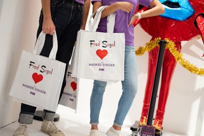 Fred Segal featured a display of the Queen of Hearts from season six and gave away branded tote bags. Some recipients received Fred Segal gift cards valued at up to $100 inside the totes, while two winners were given a pair of tickets to a live taping of the show.