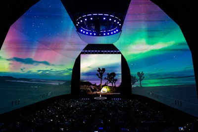 For the 10th anniversary of Samsung’s Unpacked event, the electronics brand enhanced the experience with a striking main stage, which featured two arches that measured 43.2 by 25.6 meters and were connected to create a cathedral-like structure. Branded content was projected on the two arches, as well as a separate LED screen that measured 19.2 by 19.2 meters and served as the stage backdrop. The content changed throughout the event to reflect the product unveilings and announcements.