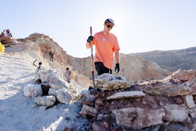 Thomas Genon helps build lines ahead of the competition. Riders and their teams can dig and craft the natural terrain for their lines within the marked area over the first four days with shovels, picks, and sandbags.