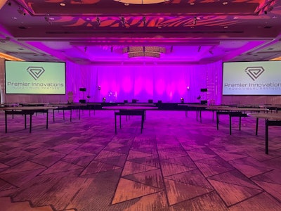 For a meeting in Hawaii, we provided a dual-screen setup with white drape. We also provided the up-lights and used gobos all around the room, per the client's request.