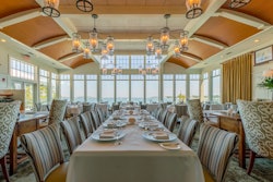 At Twenty-Eight Atlantic at Wequasset Resort & Golf Club on Cape Cod, the private dining room's focal points are its floor-to-ceiling windows that offer views of Pleasant Bay.