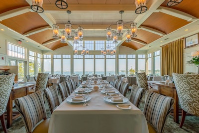 At Twenty-Eight Atlantic at Wequasset Resort & Golf Club on Cape Cod, the private dining room's focal points are its floor-to-ceiling windows that offer views of Pleasant Bay.