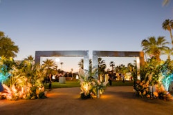 A mirrored entrance moment immediately set the tone for the desert oasis-inspired gathering.