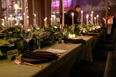 The supper club experience featured a special four-course menu designed by Onwuachi. Each course reflected a 2024 travel trend, introduced by Porowski and paired with nonalcoholic wine and cocktails. Table decor made an impact with tall candles and simple greenery.
