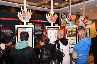 The menu included a Chiefs-themed double cheeseburger with extra ketchup, and the trays were lined with paper explaining the game of football in basic terms.