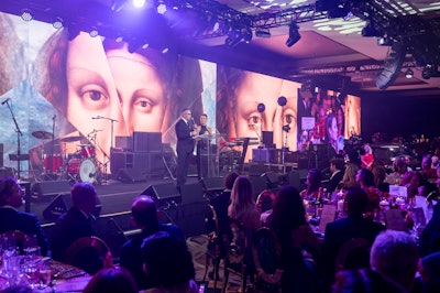 Husband-and-wife duo Shareef Malnik and Gabrielle Anwar hosted the main programming, which featured a large LED panel carrying digital images of Mona Lisa into the ballroom.