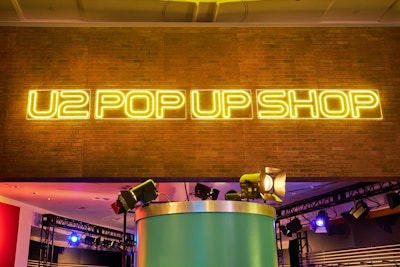 The gift shop, called the U2 Pop Up Shop, uses the typeface from the band’s 1997 PopMart Tour.