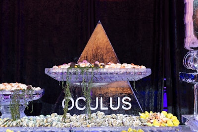 An 80-square-foot ice sculpture sporting the OCULUS theme housed an endless array of sushi, snow crabs, shrimp cocktail, and oysters for the two-hour cocktail reception.