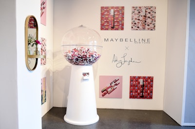 At New York Fashion Week in 2019, Maybelline launched a new limited-edition makeup collection with NYFW artist-in-residence Ashley Longshore. At Spring Studios, the beauty brand designed a build-out, complete with a giant gumball machine that dispensed the new products. See more: 19 Sponsor Highlights From New York Fashion Week