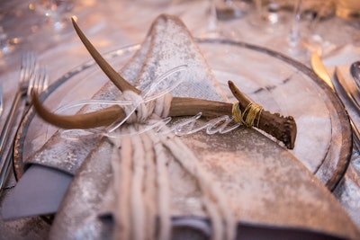 At the table settings, guests' names evoked shards of ice. Another fun touch? Digital mapping of falling snow along with birch tree projections transported guests into an arctic retreat.