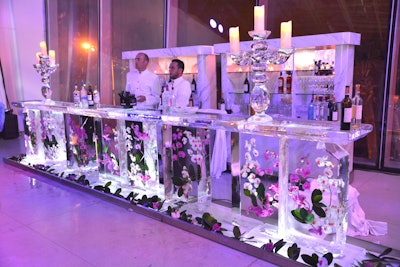 A bar was made from ice and florals. See more: 17 Ideas We Loved From Winter Benefits