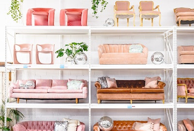 Something Vintage's colorful pink sofas line their DC showroom.