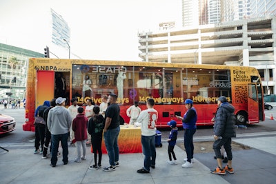 The high-tech bus featured glass windows on one side (pictured) and digital screens on the other. When the bus wasn't officially activating, the windows had pull-down shades that weren't completely opaque, so passersby could 'sort of see what was in there and build that anticipation,' Wright said.