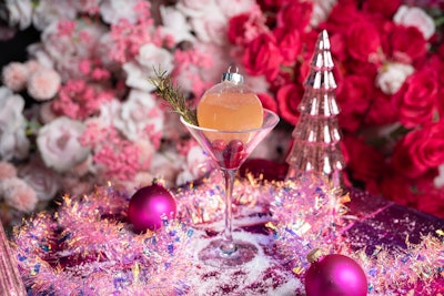 The All That Glitters cocktail is infused with New Amsterdam vodka, allspice, cranberry, ginger beer, and rosemary.