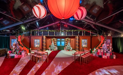 The design featured evergreen trees, piles of colorful gifts, and plenty of candy cane-inspired details.