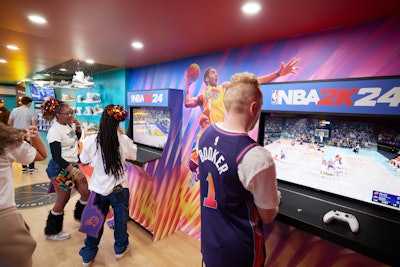 Presenting sponsor NBA 2K was a major touchpoint on the bus. Visitors could interact with these special gaming cabinets meant to look like 'old-school arcade games,' Wright said, and play the newest iteration, NBA 2K24.