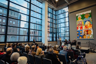 Speakers take the stage at the Summit building's Celebration of Art event.