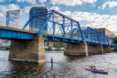 Experiences in Grand Rapids include kayaking by the iconic Blue Bridge.