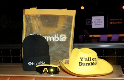 Bumble, which sponsored the event, handed out branded swag including a yellow cowboy hat.