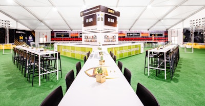 Triton Productions transformed the space into an 'in-stadium' environment using end zone lounges, X’s and O’s playbook-inspired food stations, and a scoreboard-themed focal-point bar.