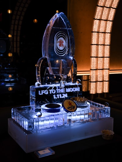 Guests enjoyed crispy fried chicken and light bites while sipping cocktails and bubbly from an eight-foot Champagne display. A lavish spread featured Petrossian caviar in a rocket ship ice sculpture and a raw bar paired with vodka.