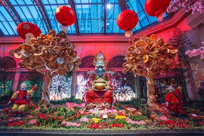 At the North Bed, Caishen—the Chinese god of wealth—sits among an abundance of gold coins. Children play among the coins, while the background features bursts of colorful fireworks and cascading gold I-Ching coins on LED screens. Shiny gold money trees are adorned with 88 I-Ching coins each—a nod to the lucky number eight.